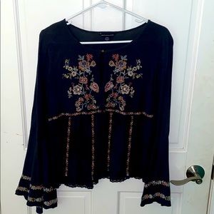 Navy and floral bell sleeve top